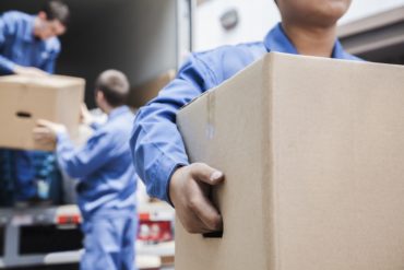 Movers unloading moving van